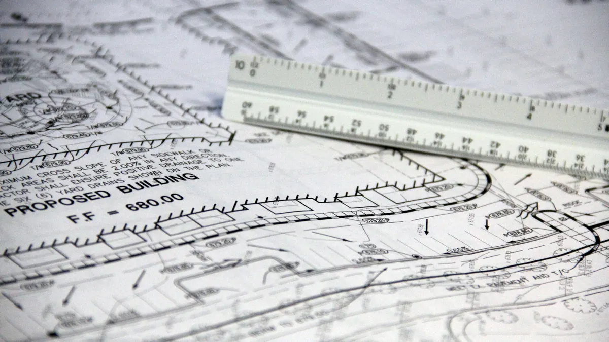 Architectural blueprint with ruler on top